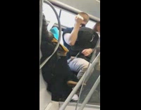 Asleep Man Pulls Flexes Arms in the Air