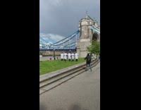 Five chefs walk together  grass london bridge