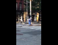 Woman dances in middle of the road