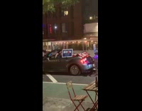 Guy grey convertible car sings karaoke restaurant