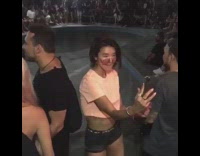 Woman orange sunglasses crop top selfie video dance