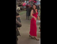 Woman poses in red dress 