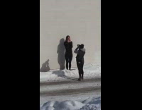 Girl black leggings black shirt wall