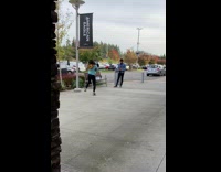 Woman in cyan jacket tiktok dance on the sidewalk