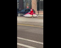 Santa parks JetSki near sidewalk