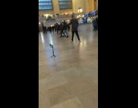 Man Poses and Walks Toward Camera Stand