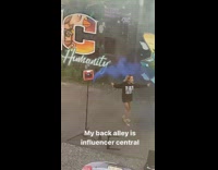 Woman black jacket music video smoke bomb