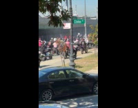 Group of motorcycle riders blocking ramp