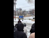 Man performing fire breathing on street