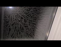 Submitter films icy window glass during winter