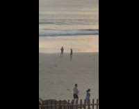 Woman play ukulele beach sunset video shoot