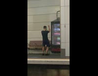 Guy black shirt dance at vending machine