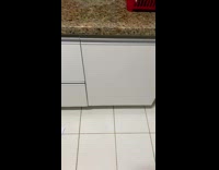 Person kicks cabinet to open 