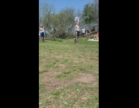 Woman tank top hold blue kite park