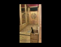 Guy attempts axe throw trick and hits own face