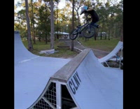 Slomo video of 8 year old biker landing a skate park 