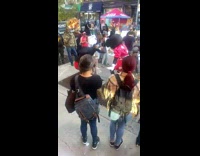 Disney characters dance along the street day in NY 