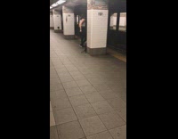 Black skinny jeans grey shirt dancing subway station platform