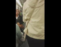 man in hat plays flute drags toys behind him