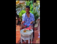 Woman splash pool water to man eat watermelon