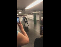 Michael Jackson impersonator dances to Billie Jean in subway station