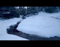 Man fishing on lake sits on ice