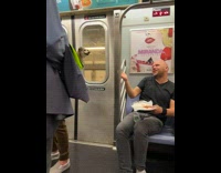 Guy on subway feeds dog inside backpack a piece of pizza