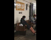Guy mask covers face bench subway station 