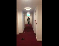 Guy sweater gets stuck on hanging light 