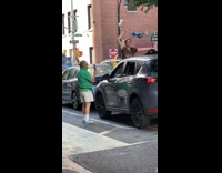 Collab WINY - Woman brown shirt redirects traffic using bra 