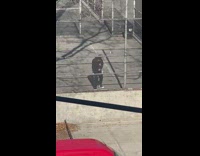 Guy black jacket rap metal fence van