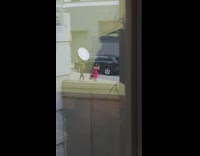 Woman red dress assistant hold flash umbrella