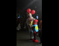 Pennywise with boxy boo on the street