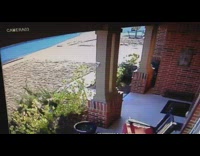 Woman in robe falls on driveway after taking out the trash to sidewalk