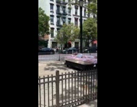 Someone is found sleeping on mattress on street barrier 