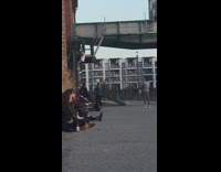 Guy white top hang metal bridge parkour