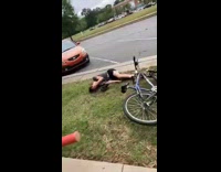 Guy blue bicycle falls off brick wall 