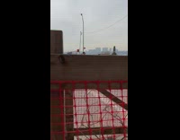 Guy walks in heels and COVID costume 