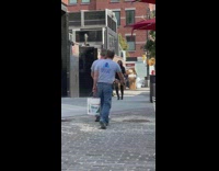 Two girls long boots walk from gate