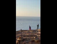 Collab IITW - Woman takes picture behind restricted area signage