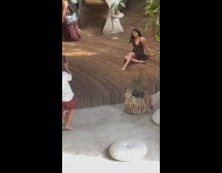 People in a different photoshoot inside the wooden house