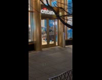 Band and bagpipes play inside Citibank vestibule