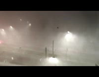 Strong rain and wind seen on street