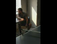 Orange ping pong ball hits a guy in the face 