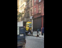 Men load despicable me minion statue on truck part 2