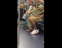 Old woman ride train with cockatoo parrot