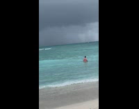 Person in beach film rain far away