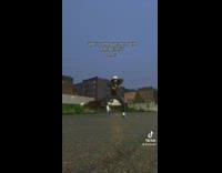 Guy dances in the street at night