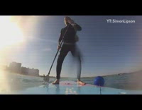 Guy makes espresso on blue paddle board 