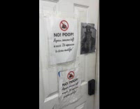 No poop sign all over restroom walls